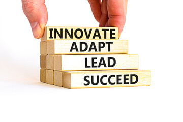 Innovate adapt lead succeed symbol. Concept words Innovate Adapt Lead Succeed on beautiful wooden blocks. Beautiful white background. Business innovate adapt lead succeed concept. Copy space.