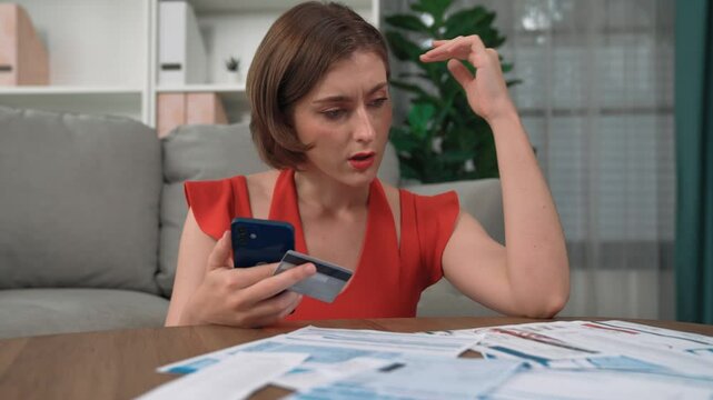 Stressed young woman has financial problems with credit card debt to pay prim from bad personal money and mortgage pay management crisis. Woman worry about financial bankruptcy risk from over spending