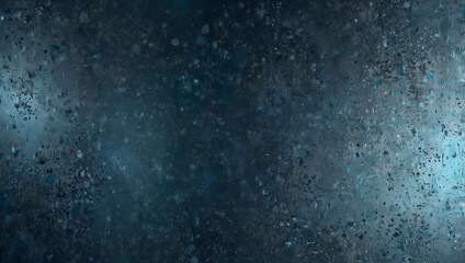 Obraz premium A dark blue background with lighter specks and streaks creates a textured, almost cosmic effect. 