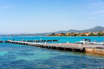 Obraz premium Boat in Golfo Aranci marina in the coast of Sardinia, Italy