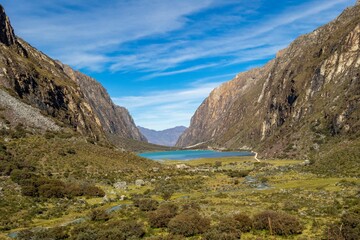 Scenic view of Llanganuco Lake in Huascaran National Park, Peru, nestled between majestic mountains.
