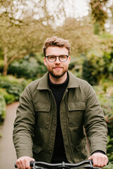 Biking through a lush park nature adventure outdoor lifestyle close-up view