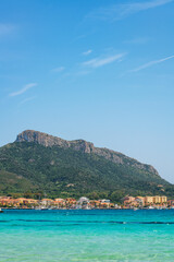 Golfo Aranci beach view from the other side of the bay with turquoise water in Sardinia, Italy