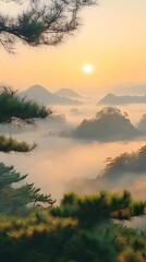 Fototapeta premium Sunrise over misty mountain landscape