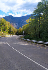 paved highway in a mountainous area in early autumn with panoramic views