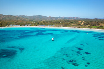 Drone aerial view of Brandinchi beach with white sand and turquoise water in Sardinia, Italy