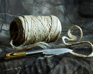 Rustic Twine and Knife on Camouflage Fabric