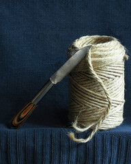Vintage Knife and Twine on blue Fabric