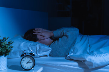 Annoyed, stressed, anxiety asian young woman suffering from insomnia, frustrated awake on bed at...