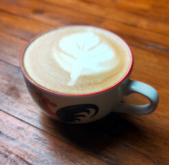 a cup of latte coffee on a wooden table