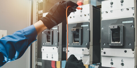 Electrical equipment maintenance service engineer Engineers carry AC voltmeters to check voltage at...