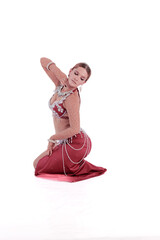 Dancer in red oriental costumes dance belly dance on the white background