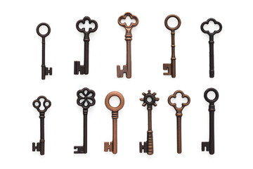 Collection of different old vintage keys isolated on white background