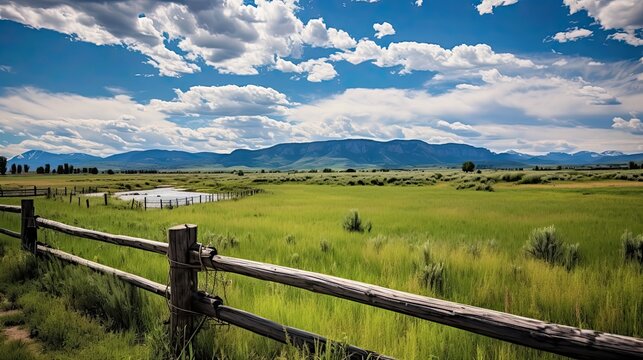 Big Sky over Montana Ranch. Majestic Landscape of Rolling Hills and Mountains with Blue Sky and Billowing Clouds