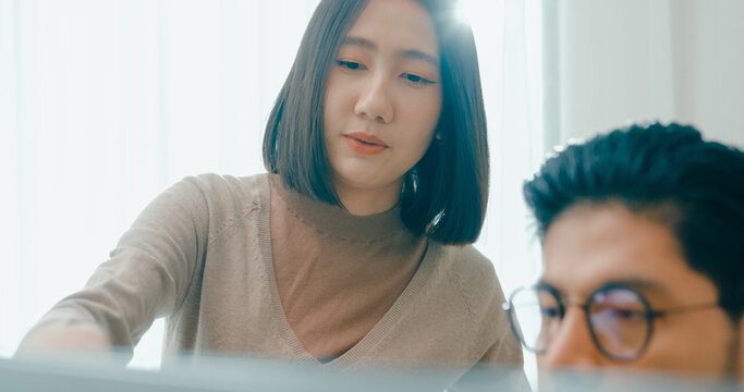 Closeup group Adult Asia male, female freelance meeting write prompt AI bot IT app smart program nomad, video game, talk strategy, discuss plan, user interface, designer, data center desktop computer.