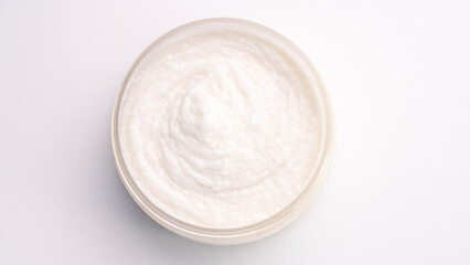 A white substance in a glass bowl. It is creamy and smooth