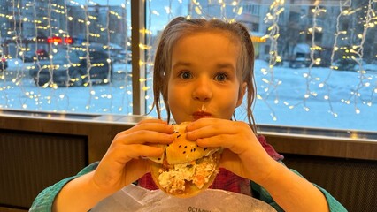  little girl eating burger