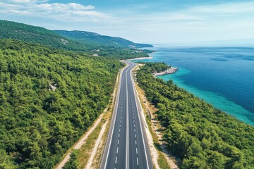 Obraz premium The view from above is of a straight highway with the sea on one side and the forest on the other. Beautiful nature