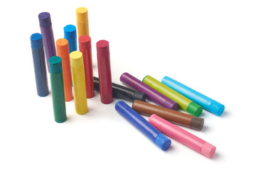 scattered oil pastels or crayons isolated white background, multicolor pastels mock-up template with blank labels