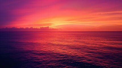 Obraz premium Breathtaking Sunset Over Calm Ocean Waters with Vibrant Lighting and Rich Color Gradient, Ideal for Evoking Tranquility and Natural Beauty in Scenic Landscapes or Travel Themes