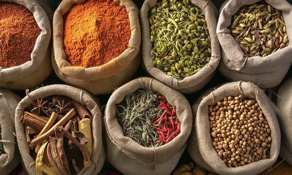 Turkish A variety of spices are displayed in bags, including cumin, coriander, and chili powder