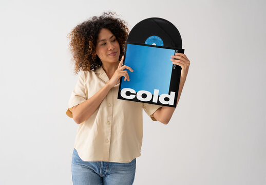 Mockup Of Woman Holding Customizable Record In Sleeve