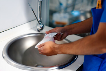 hospital nurse performing hand washing procedure