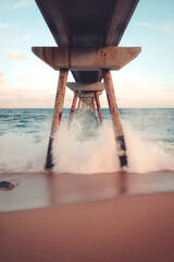 long exposure of the waves under the bridge