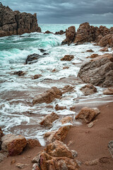 long exposure against the rocks on the beach