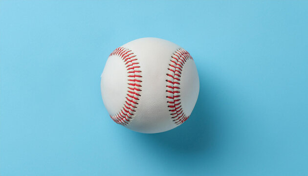 Classic baseball ball on pastel blue background. Close-up.