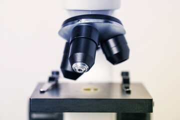Science. Modern microscope on light background, closeup