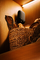 Freshly baked bread displayed attractively on wooden store shelves inviting customers to enjoy a...