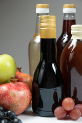 Different types of vinegar. Balsamic, pomegranate and apple vinegars in bottles