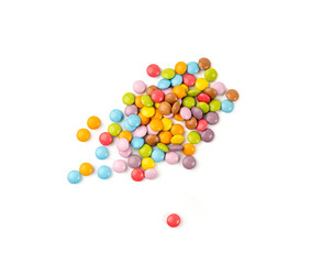 Scattered small candies isolated. Colorful dragees, multicolored glazed chocolate buttons