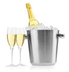 Champagne in glasses and ice bucket with bottle isolated on white