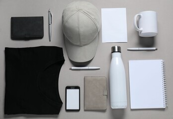 Different blank items for branding on grey background, flat lay. Mockup for design