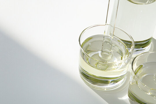 crystalline glycol substance close-up, spotless white setting, technical lighting setup 