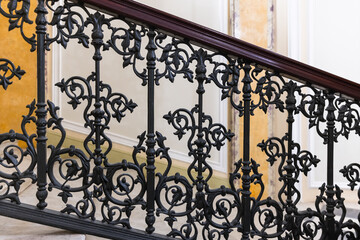 Vintage ornamental handrails with black forged iron decoration