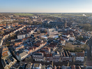 Fototapeta premium Aerial drone photo of the old town hall and the market square in the city center of Gouda, the Netherlands.