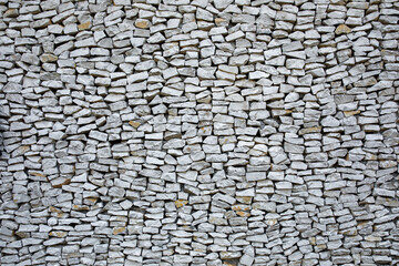 Background of stone wall. Stone wall texture with different sized stones as background.