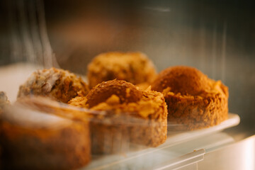 Delicious cakes displayed in a pastry shop showcasing craftsmanship and creativity