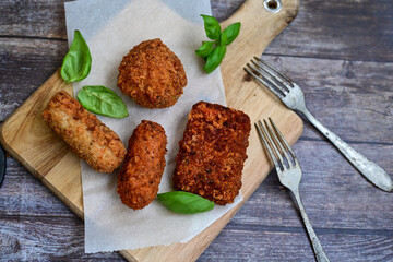 Traditional Fried Snacks  Roman  street Food. Arancini, fried lasagne , stuffed balls rice Crocche and fried pasta. 
 Italian gastronomy travel concept 
