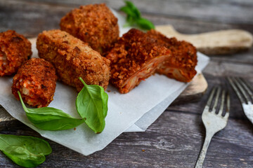 Traditional Fried Snacks  Roman  street Food. Arancini, fried lasagne , stuffed balls rice Crocche and fried pasta. 
 Italian gastronomy travel concept 