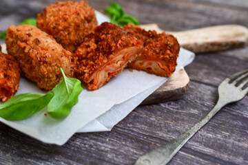 Traditional Fried Snacks  Roman  street Food. Arancini, fried lasagne , stuffed balls rice Crocche and fried pasta. 
 Italian gastronomy travel concept 
