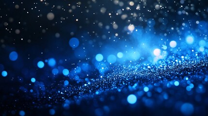 Fototapeta premium A mesmerizing display of shimmering blue particles creating a dreamy, ethereal atmosphere.