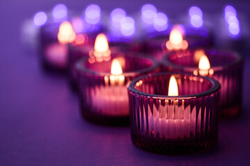 Purple Candle Glow. Warm candlelight in glass holders