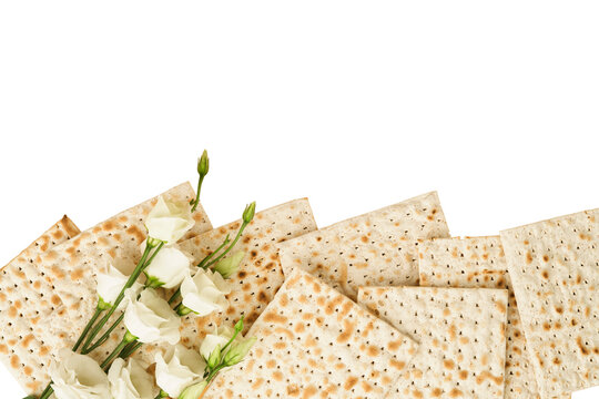 Passover Pesah celebration concept. Matzah, kosher red wine, walnut and white and yellow roses. Traditional ritual Jewish bread on sand color old tile wall background.  Pesach Jewish holiday. Top view