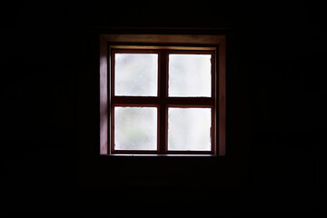 The window of an old wooden house. Textured window silhouette.