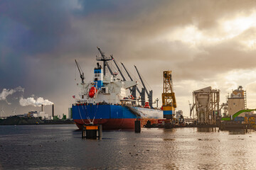 A cargo ship docked in the seaport of Amsterdam.