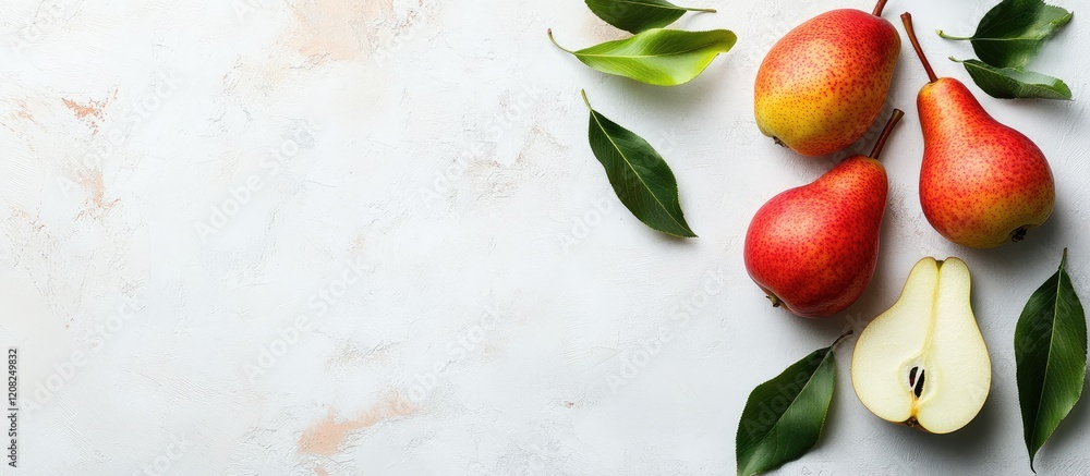 Poster fresh red and yellow pears with green leaves on white marble background showcasing half pear and amp